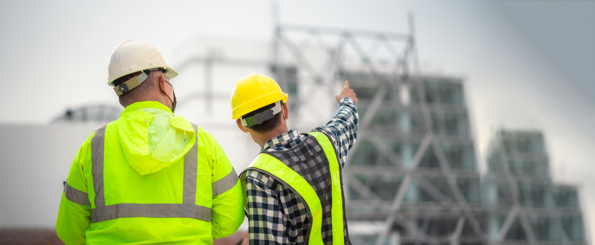 Builders looking at a buiding